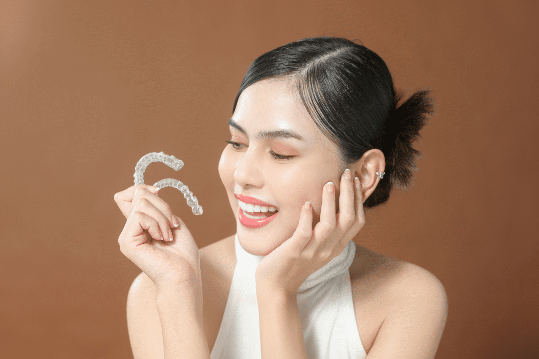 person holding invisalign