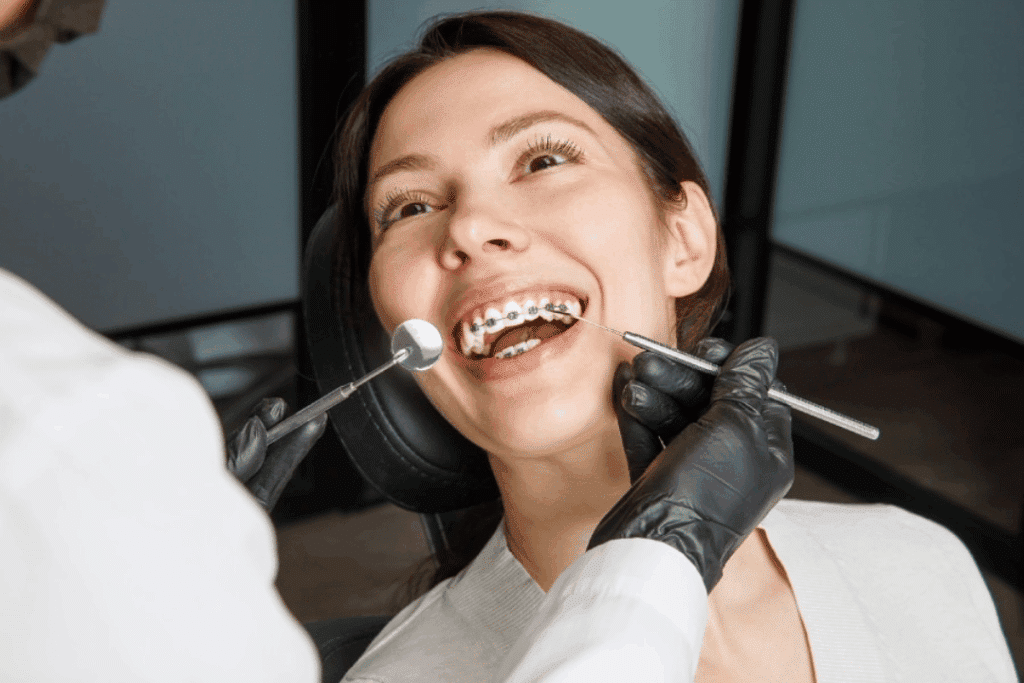 orthodontist adjusting braces